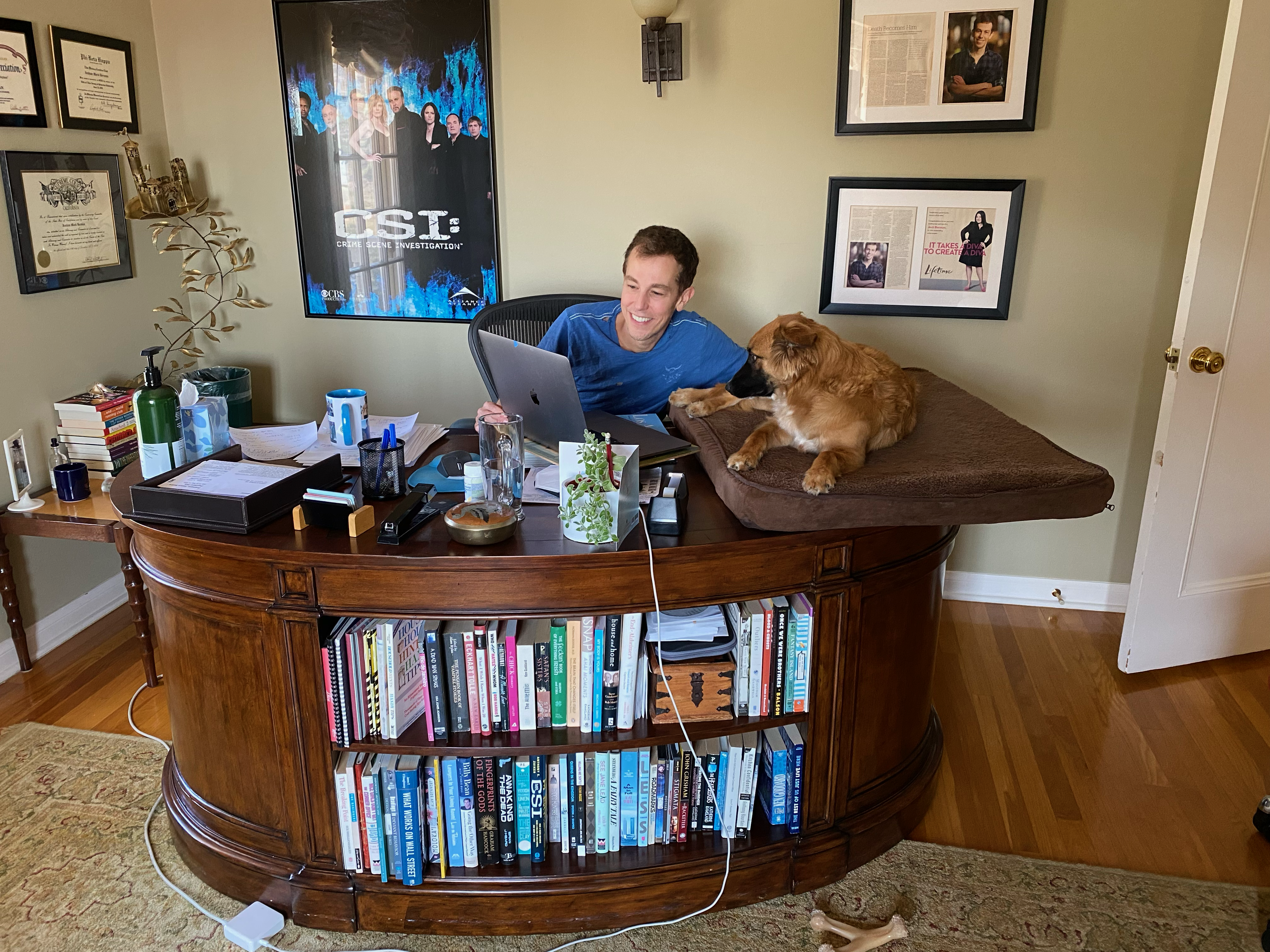 Josh working on Dead Matters with his rescue dog, Luna